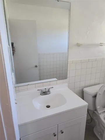 a bathroom with a sink and a toilet