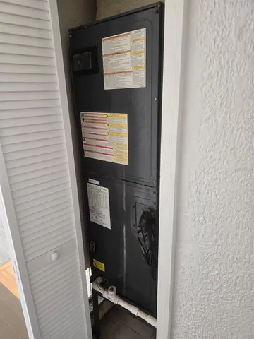 a view of a livingroom with wooden floor and cabinet