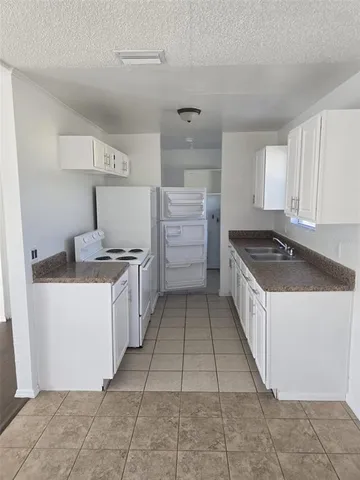 a kitchen with a cabinets and counter space