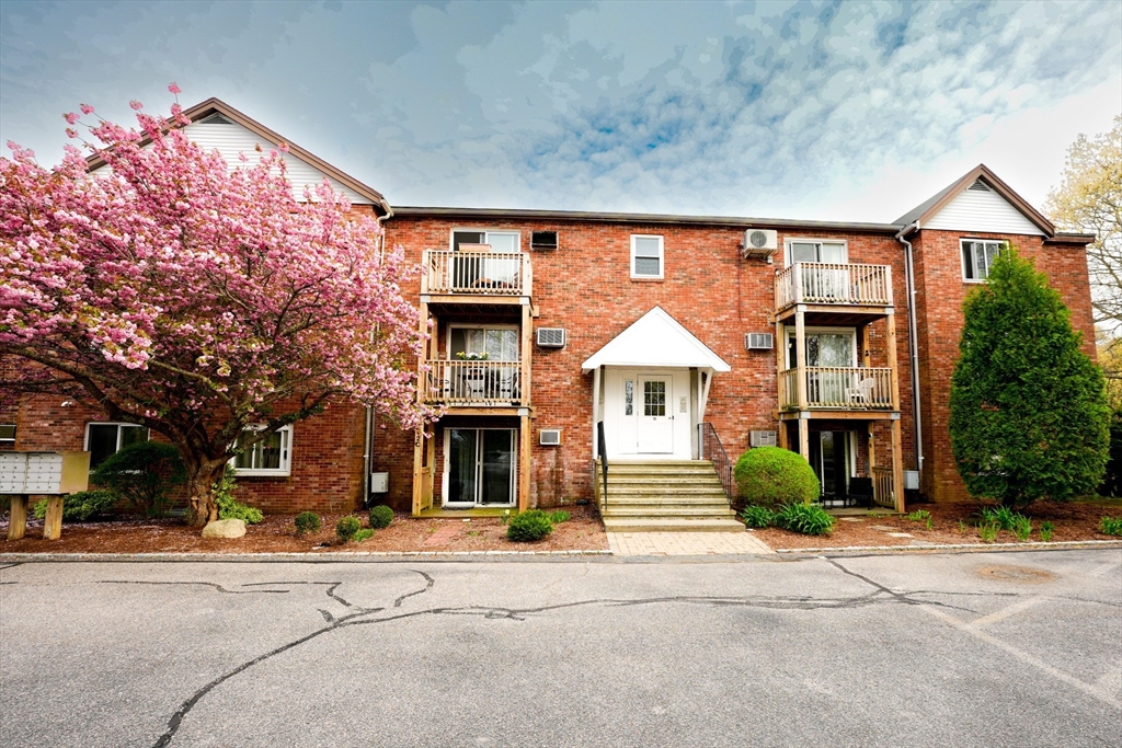 90-92 Sandwich Road, Unit 9C Bourne, MA 02532 - Photo 2 of 10 a front view of a building with street