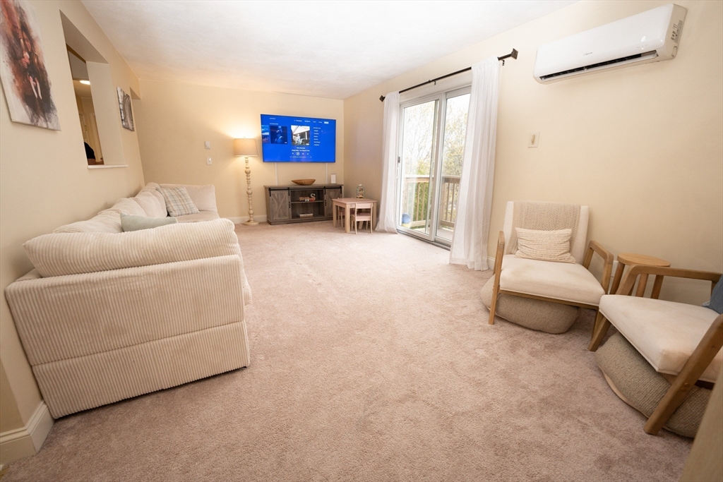 90-92 Sandwich Road, Unit 9C Bourne, MA 02532 - Photo 3 of 10 a living room with furniture and a couch