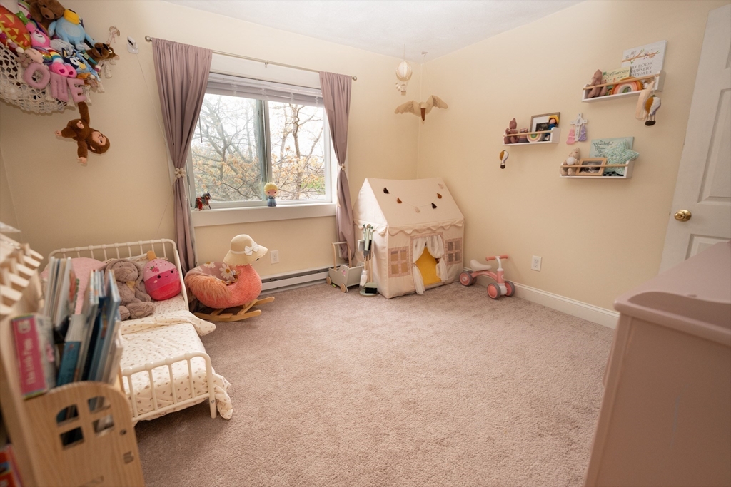 90-92 Sandwich Road, Unit 9C Bourne, MA 02532 - Photo 9 of 10 a bedroom with bed and a window