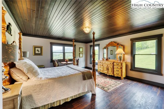 a spacious bathroom with a granite countertop sink and a mirror
