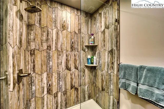 a spacious bathroom with a granite countertop toilet sink and mirror