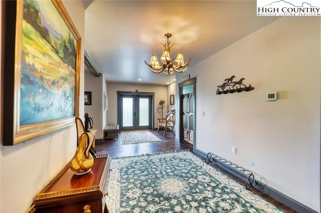 a view of an entryway with wooden floor