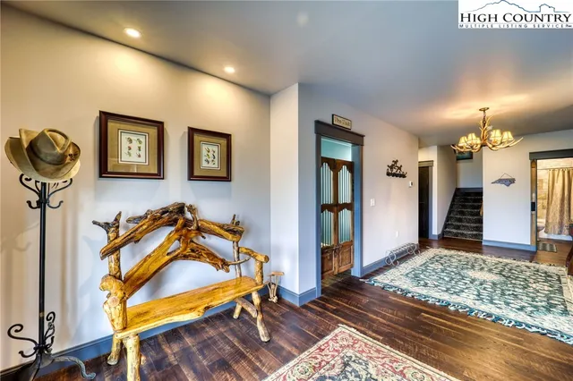 a bedroom with furniture and a rug