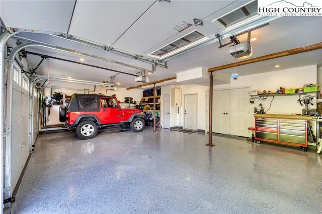 a view of a table and chairs under an umbrella