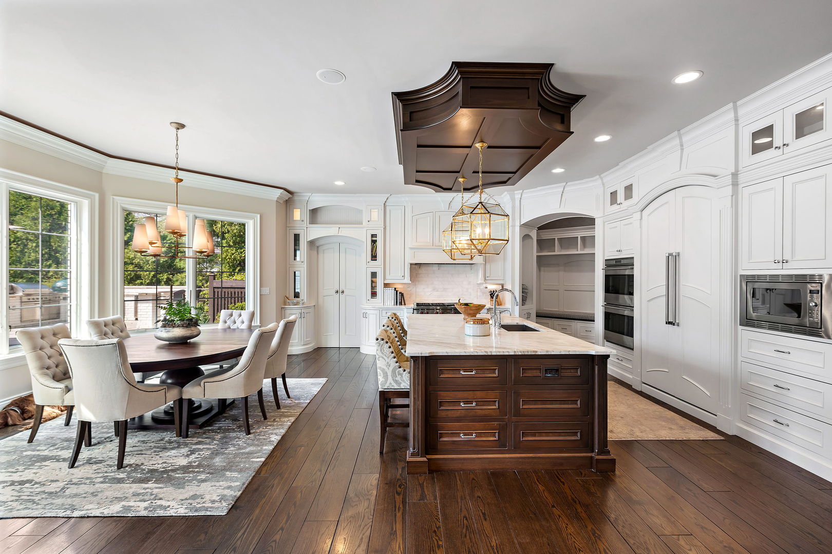 368 Ridge Avenue Winnetka, IL 60093 - Photo 11 of 55 a kitchen with stainless steel appliances granite countertop a stove and chairs