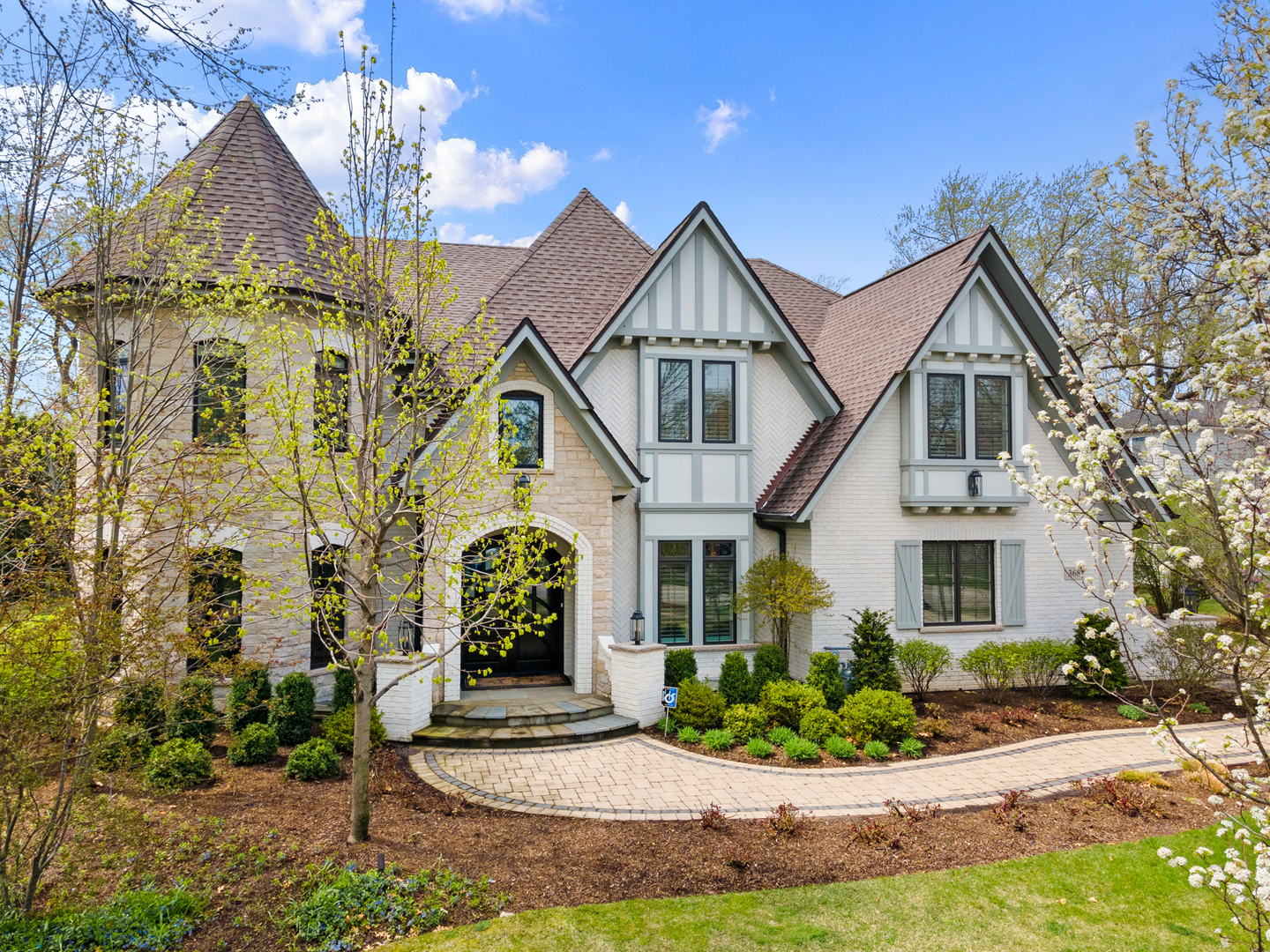 368 Ridge Avenue Winnetka, IL 60093 - Photo 2 of 55 a front view of a house with garden