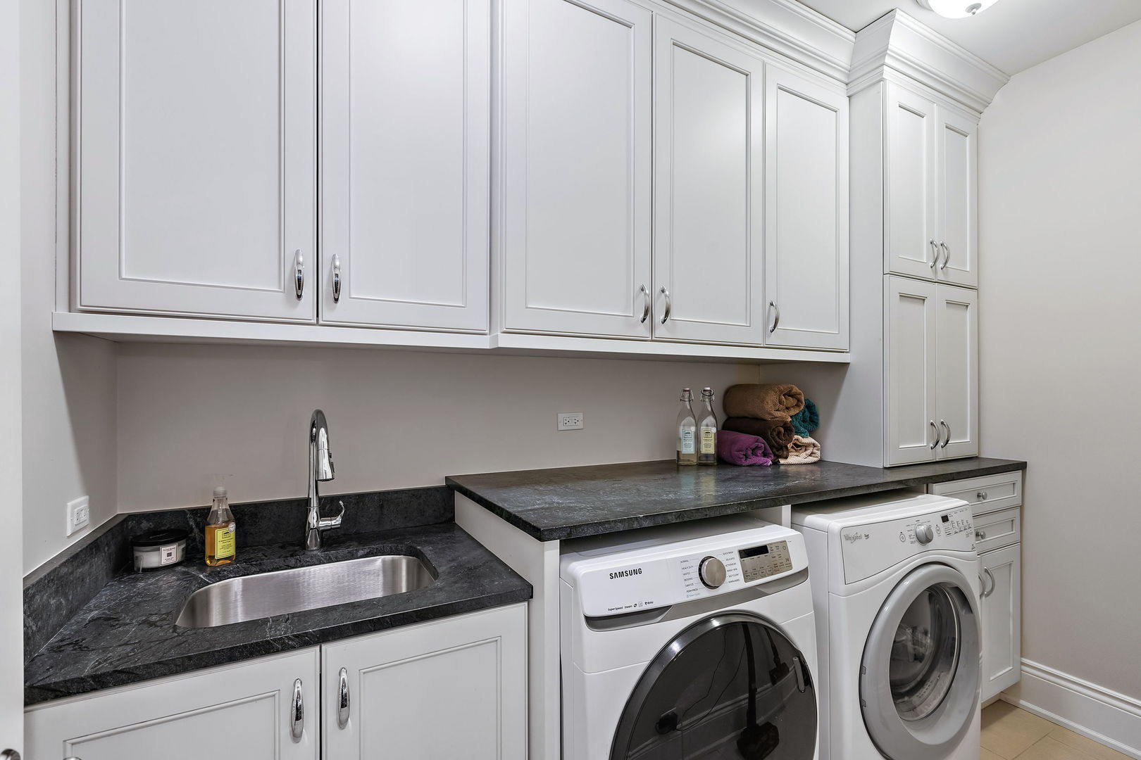 368 Ridge Avenue Winnetka, IL 60093 - Photo 39 of 55 a kitchen with granite countertop white cabinets and a sink