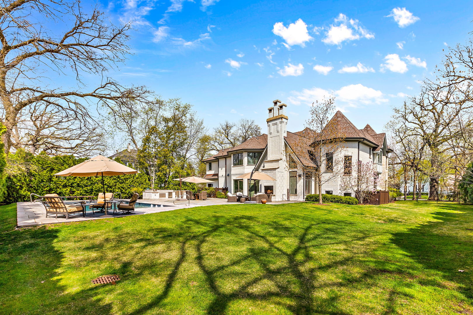 368 Ridge Avenue Winnetka, IL 60093 - Photo 44 of 55 a view of a white house with a big yard and potted plants