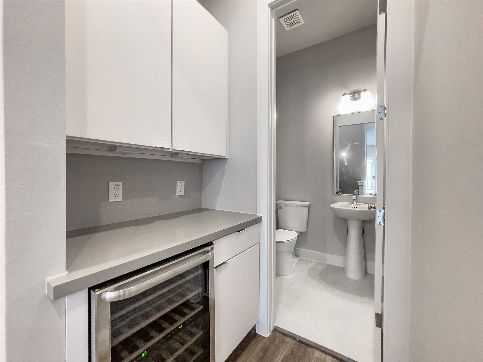1270 North Post Oak Road, Unit A Houston, TX 77055 - Photo 10 of 33 Elevate your hosting with a second-floor beverage bar, complete with a wine fridge and ample storage.