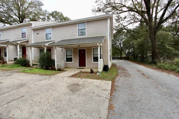 a view of a yard in front of a house