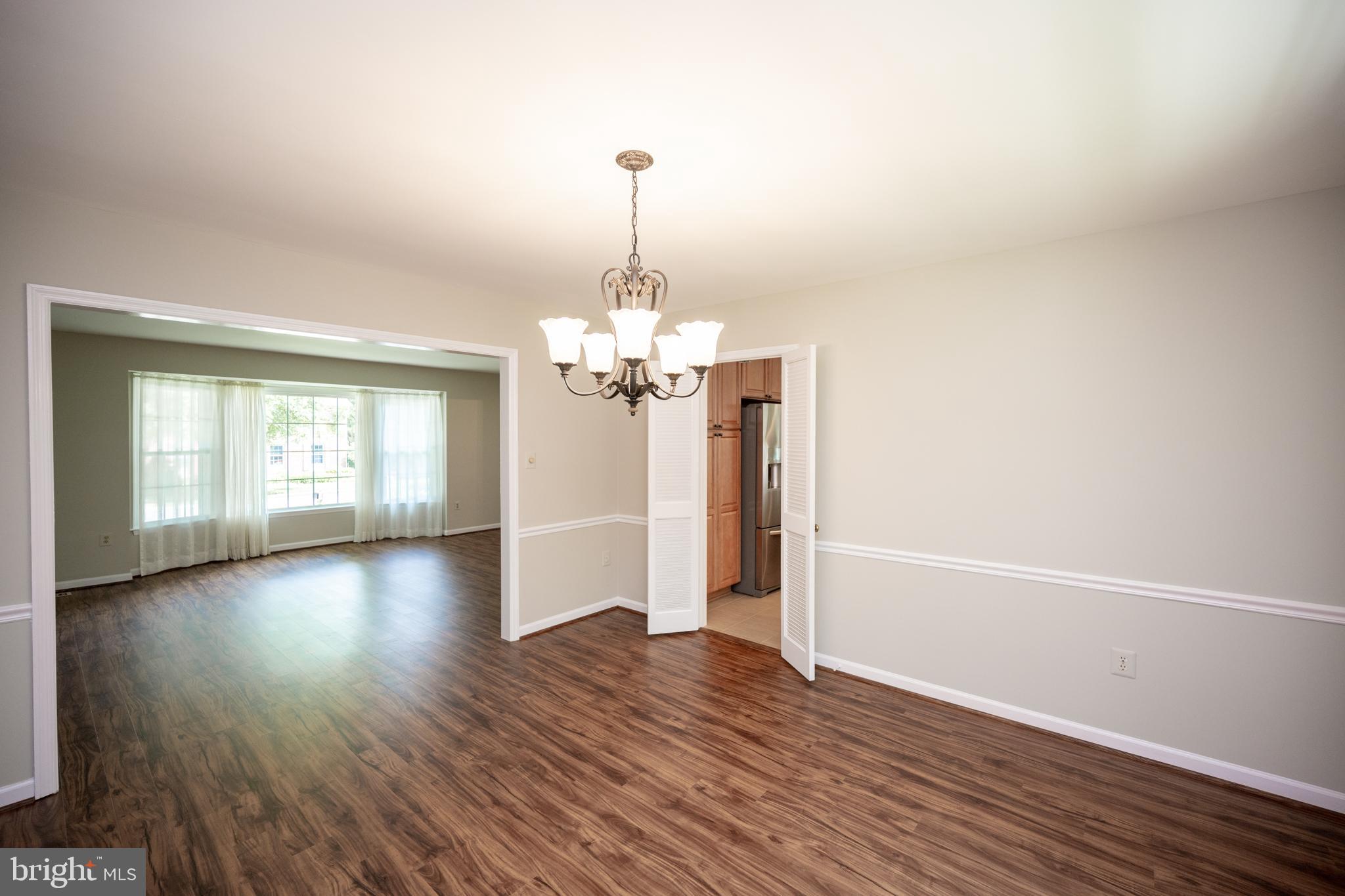 4533 Gilbertson Road Fairfax, VA 22032 - Photo 17 of 56 Luxury Vinyl Plank in living room & dining room