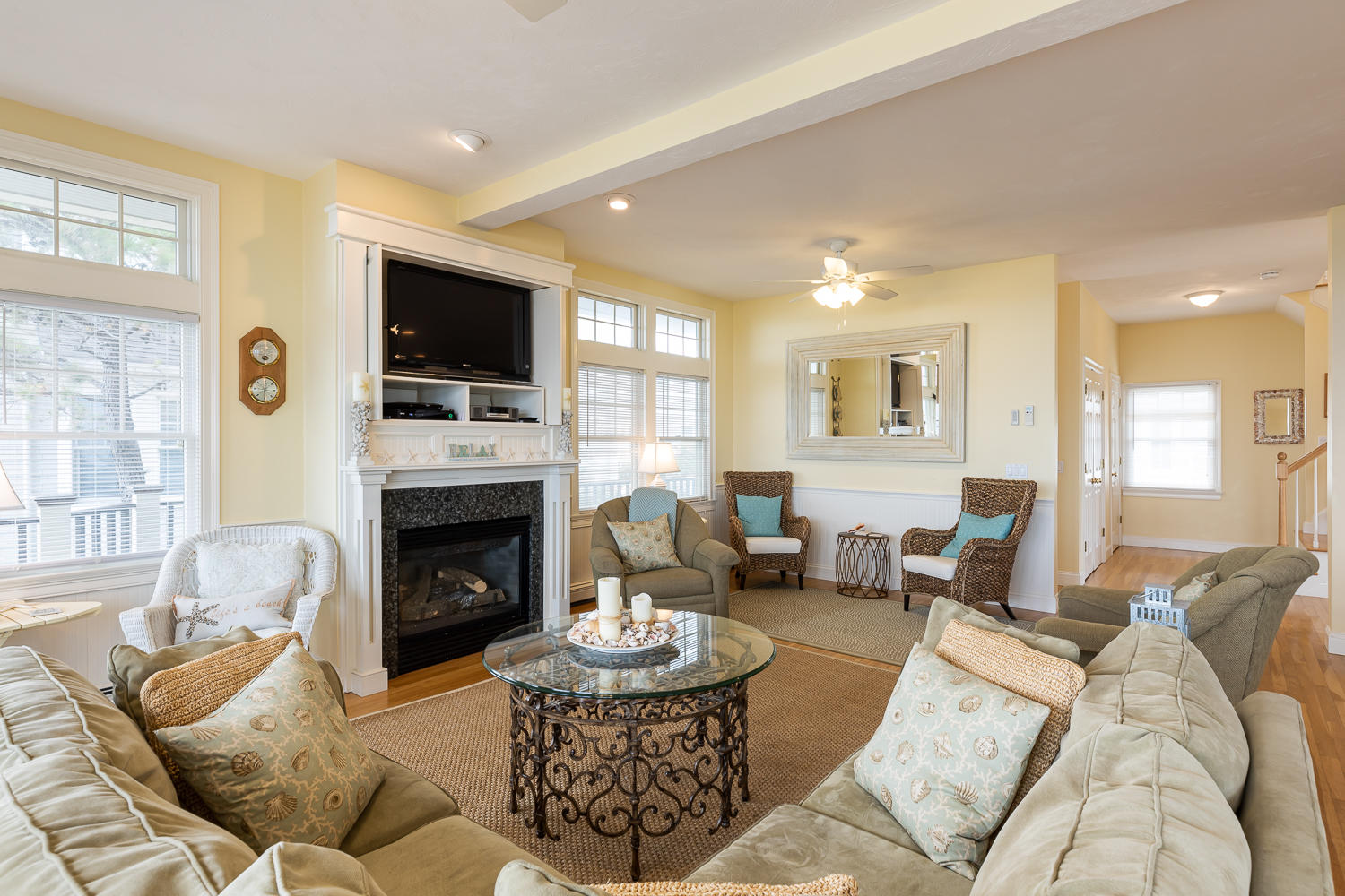 15 Deans Hollow Road Mashpee, MA 02649 - Photo 6 of 20 a living room with furniture a flat screen tv and a fireplace