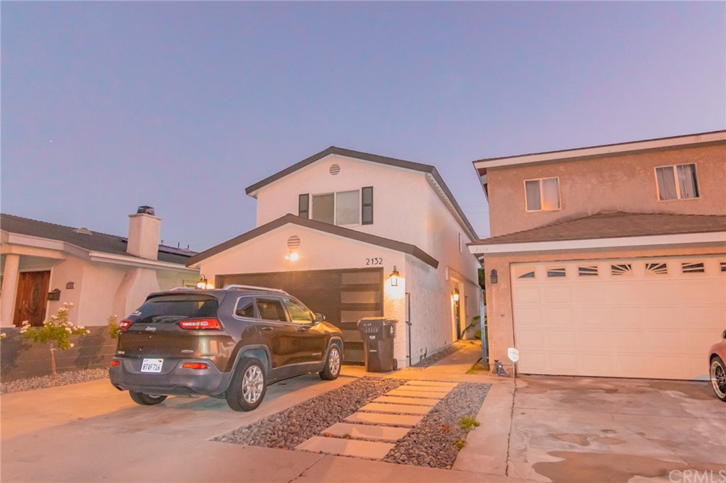 2132 West Spring Street Long Beach, CA 90810 - Photo 1 of 1 a front view of a house with parking space