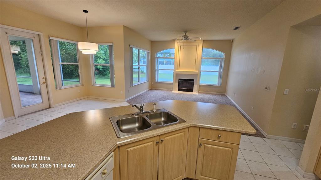 41 Creek Bluff Way Ormond Beach, FL 32174 - Photo 14 of 33 a kitchen with furniture a sink and large window
