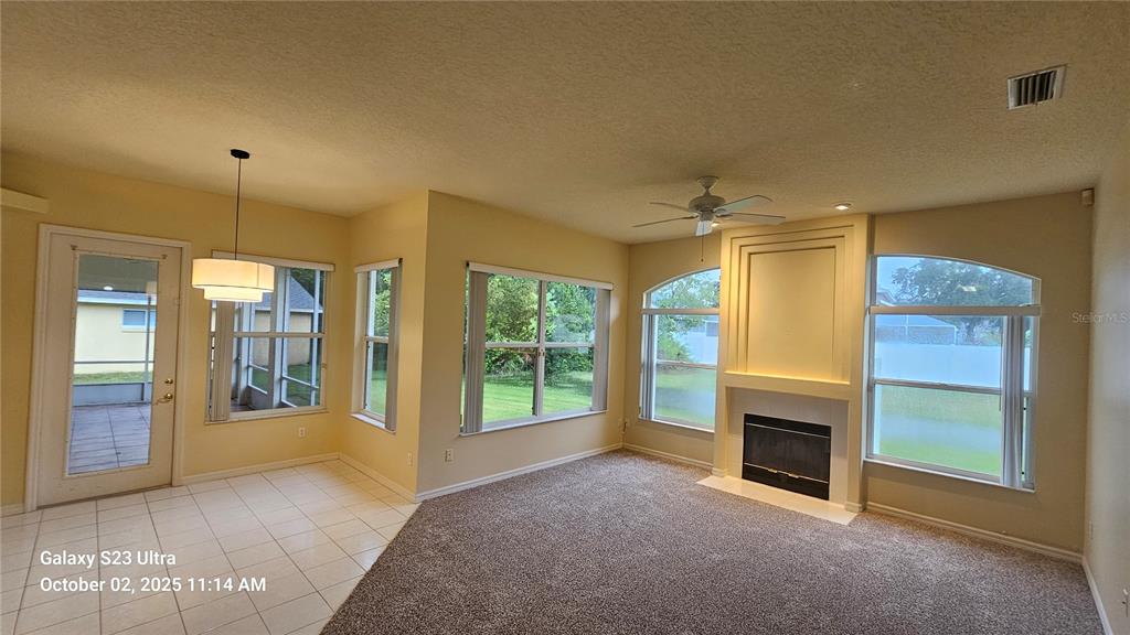 41 Creek Bluff Way Ormond Beach, FL 32174 - Photo 15 of 33 a view of a livingroom with a fireplace and window