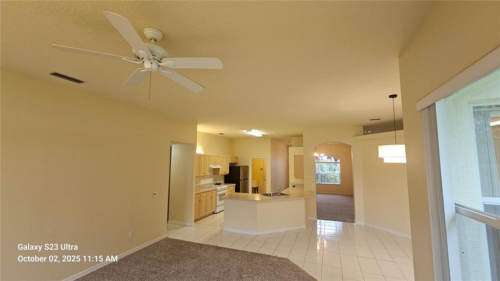 41 Creek Bluff Way Ormond Beach, FL 32174 - Photo 18 of 33 a view of a hallway with a table and chairs
