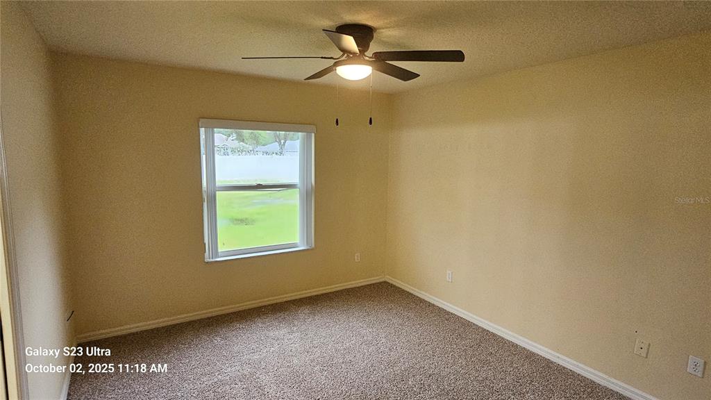 41 Creek Bluff Way Ormond Beach, FL 32174 - Photo 26 of 33 an empty room with a window and a ceiling fan