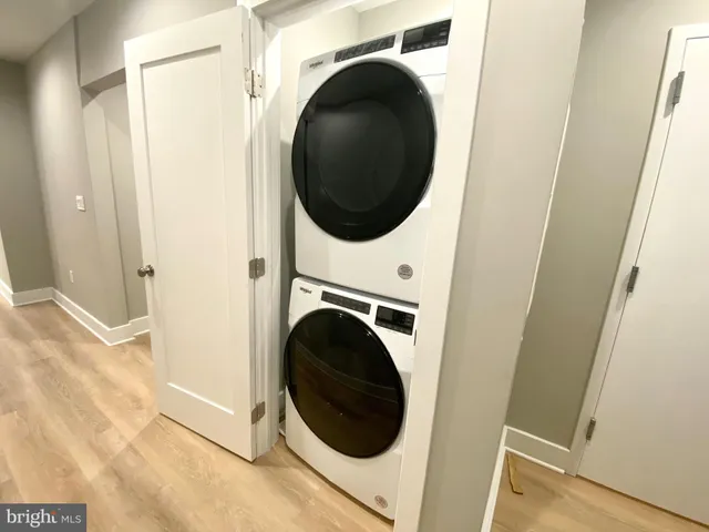 a view of a hallway with washer and dryer
