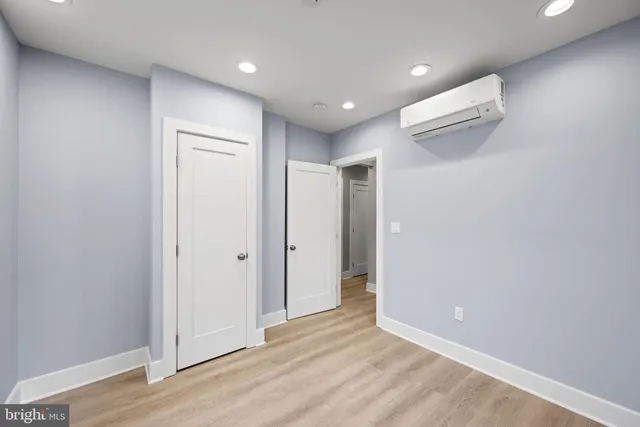 a view of hallway with wooden floor