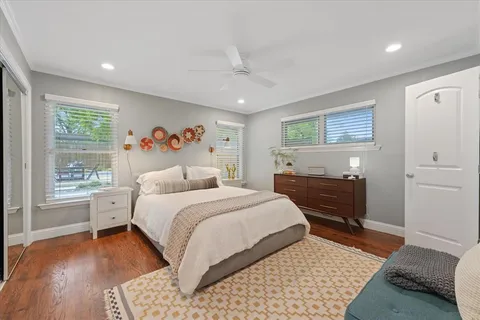 a bedroom with a large bed and a window