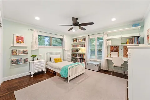 a bedroom with furniture and window