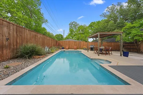 a view of a backyard with sitting area