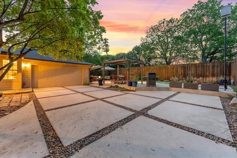 a view of backyard and patio