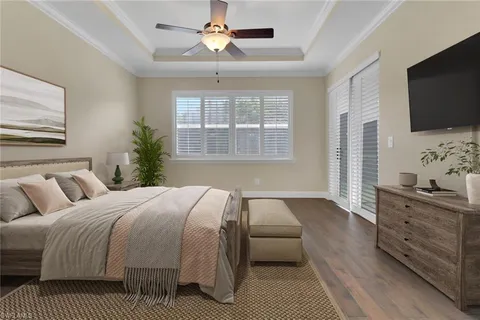 a bedroom with a large bed and a flat screen tv