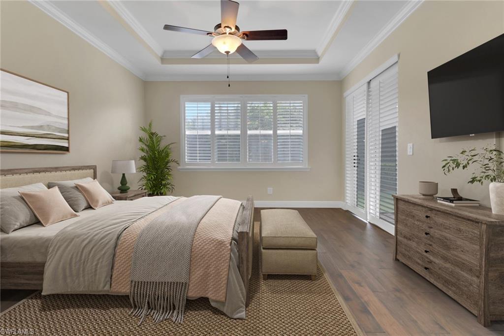 17094 Wrigley Circle Fort Myers, FL 33908 - Photo 15 of 33 a bedroom with a large bed and a flat screen tv