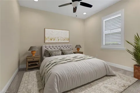 a bedroom with a large bed and a window