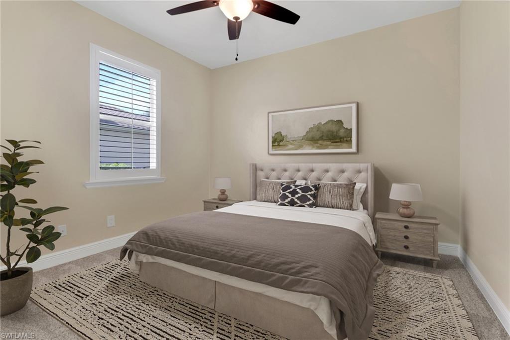 17094 Wrigley Circle Fort Myers, FL 33908 - Photo 21 of 33 a bedroom with a large bed and a window
