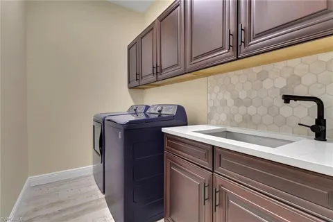 a bathroom with a sink and cabinets