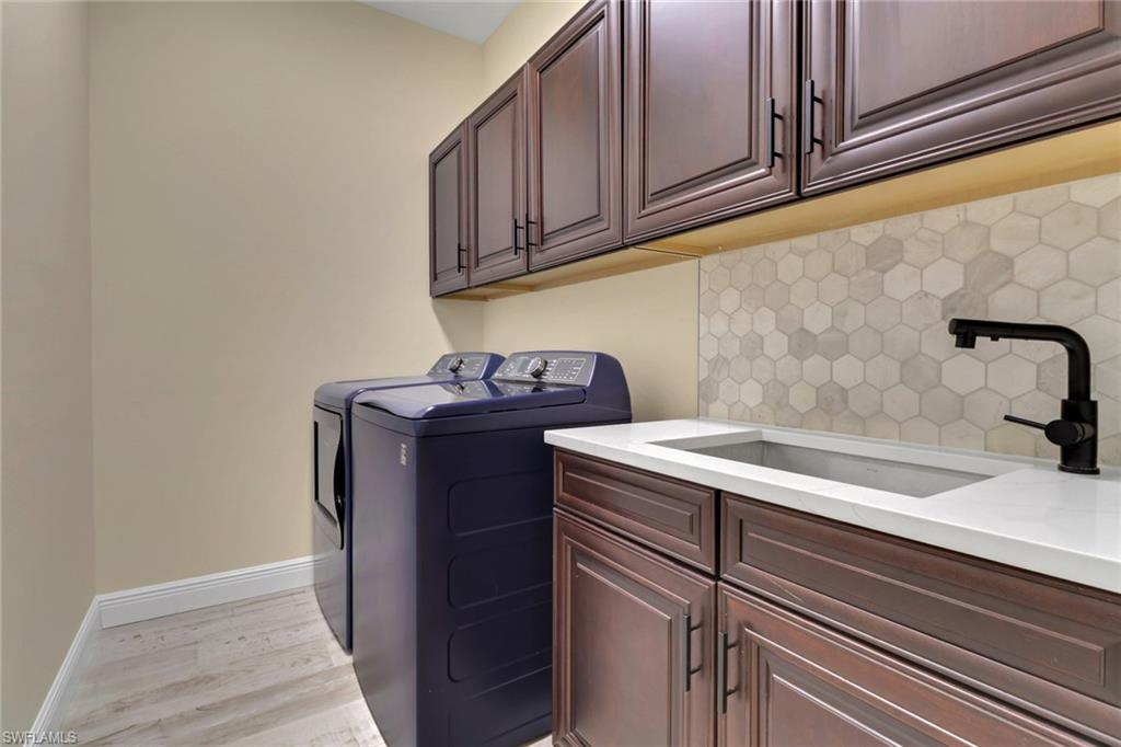 17094 Wrigley Circle Fort Myers, FL 33908 - Photo 22 of 33 a bathroom with a sink and cabinets