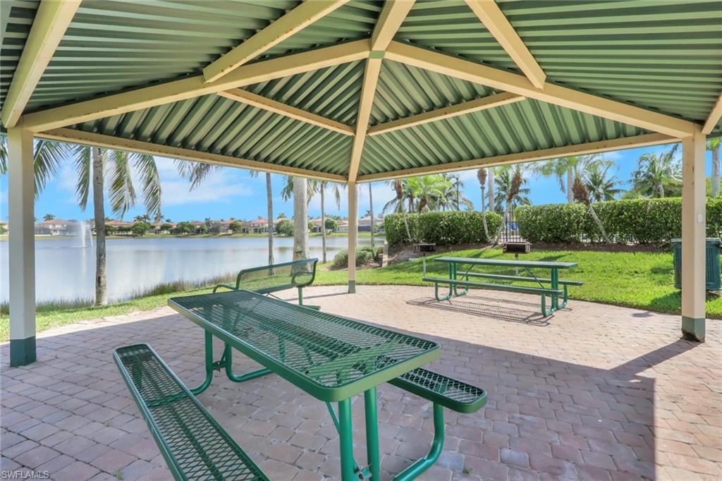 17094 Wrigley Circle Fort Myers, FL 33908 - Photo 29 of 33 a patio with a table and chairs
