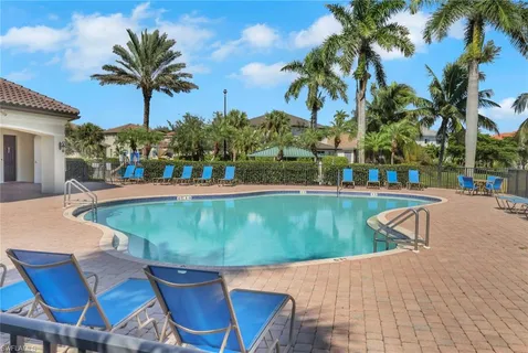 a view of a swimming pool with a lounge chairs