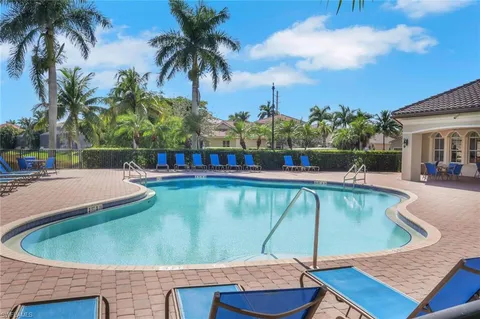 a view of a swimming pool with a patio