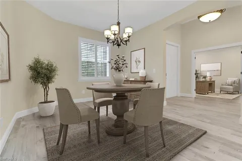 a dining room with furniture and window