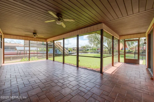 a view of an empty room with windows