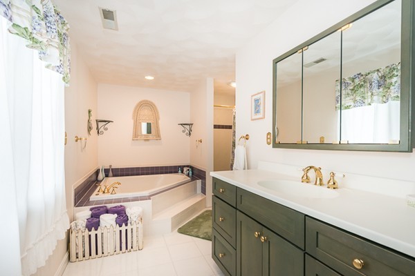 10 Scotland Road Lexington, MA 02420 - Photo 17 of 24 a bathroom with a tub sink and mirror