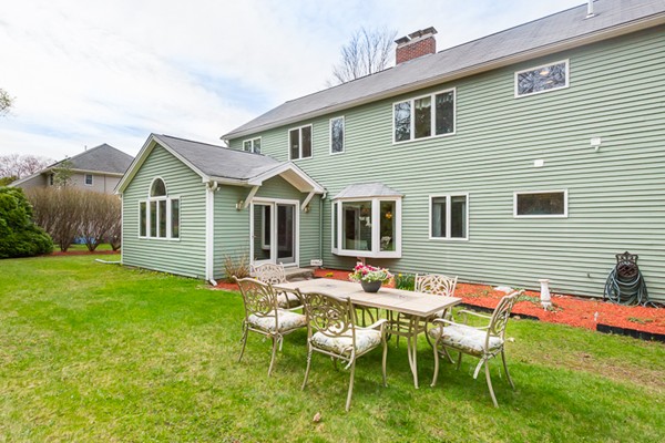 10 Scotland Road Lexington, MA 02420 - Photo 24 of 24 a backyard of a house with table and chairs