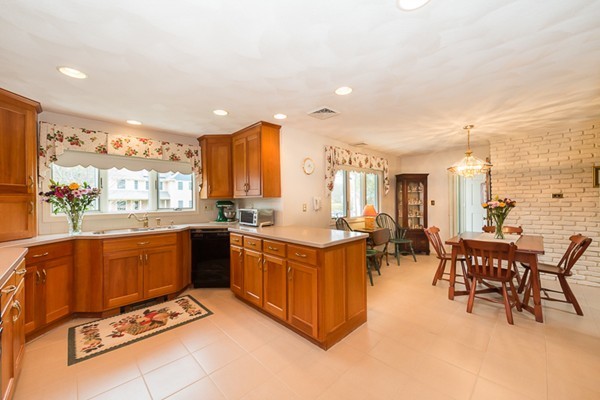 10 Scotland Road Lexington, MA 02420 - Photo 5 of 24 a kitchen with stainless steel appliances granite countertop a stove and a refrigerator