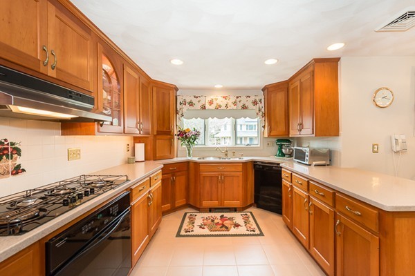 10 Scotland Road Lexington, MA 02420 - Photo 6 of 24 a large kitchen with stainless steel appliances granite countertop a stove a sink dishwasher and cabinets with wooden floor