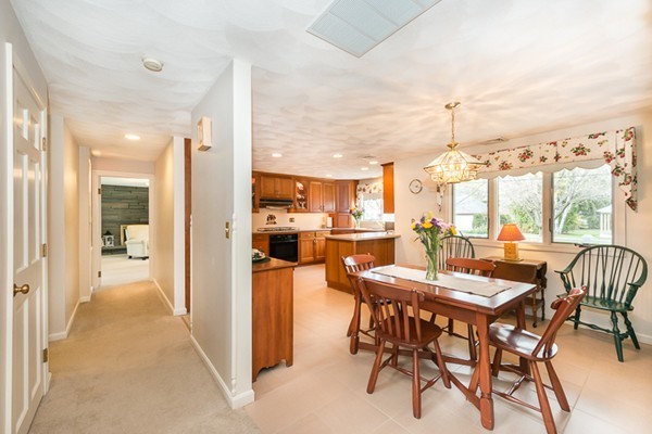 10 Scotland Road Lexington, MA 02420 - Photo 10 of 24 a dining room with furniture and a floor to ceiling window