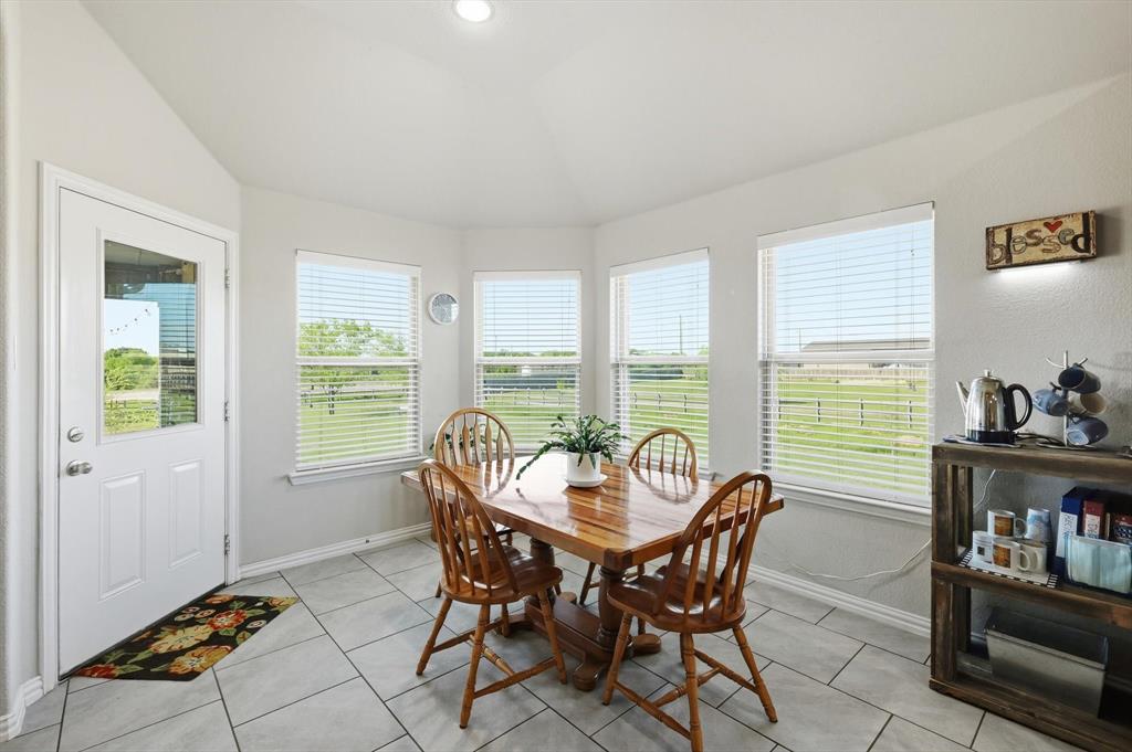 113 Heather Lane Decatur, TX 76234 - Photo 13 of 32 a dining room with furniture and large windows