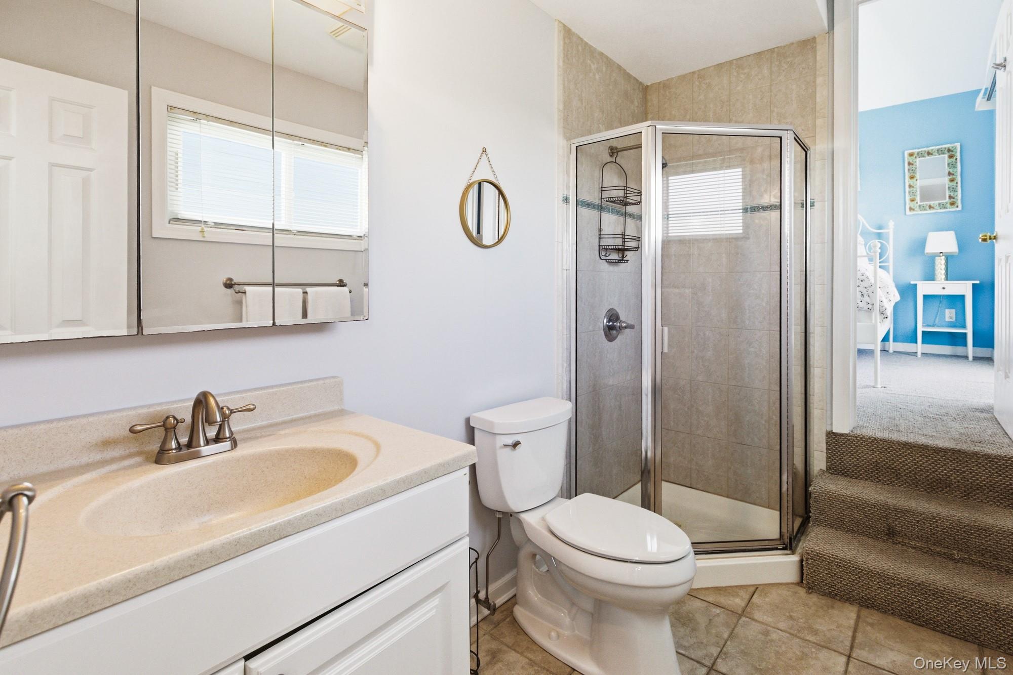 818 Dune Road Westhampton Beach, NY 11978 - Photo 19 of 30 a bathroom with a sink toilet and shower