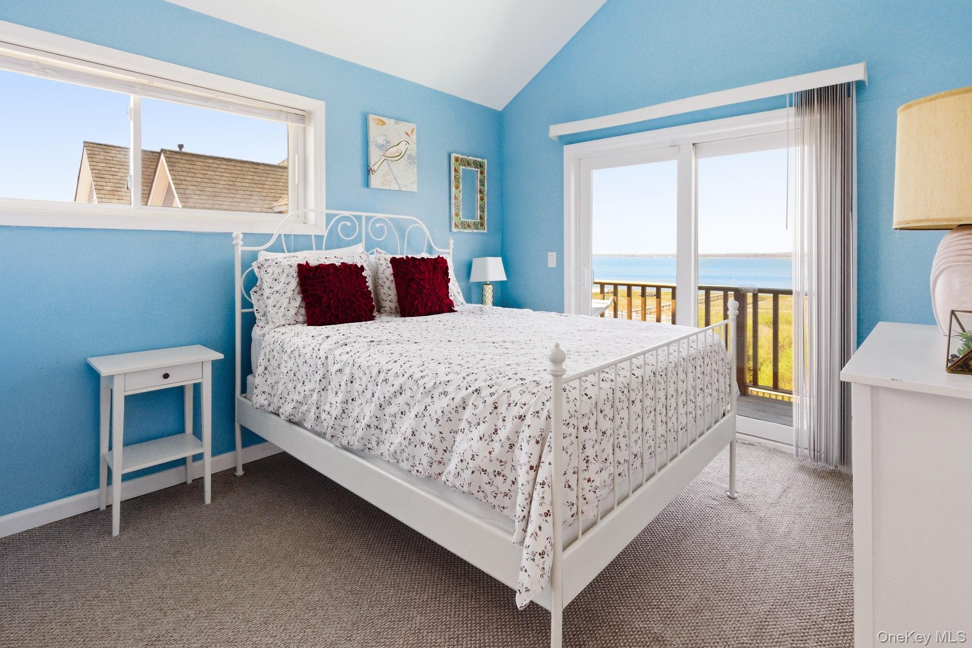 818 Dune Road Westhampton Beach, NY 11978 - Photo 21 of 30 a bedroom with a bed and a table