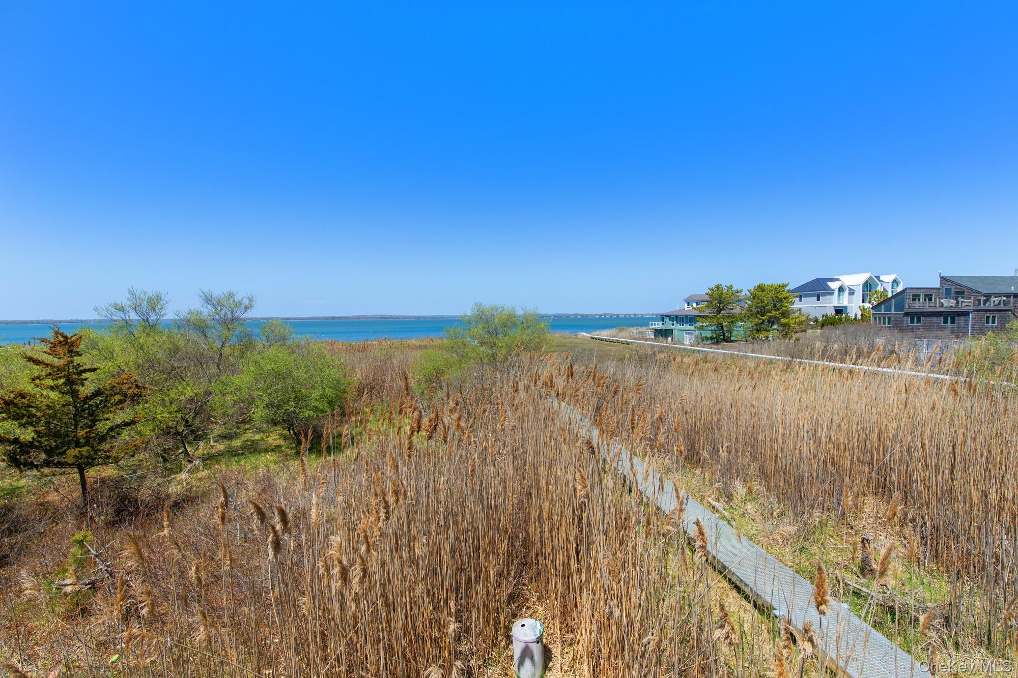 818 Dune Road Westhampton Beach, NY 11978 - Photo 27 of 30 a view of a lake with a city